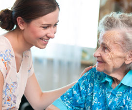 Young woman and senior woman talking to each other - Choosing a nursing home