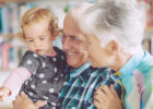 Grandpa and granddaughter hugging and smiling - Protect babies from germs