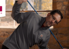 Man stretching with a ski pole - Cold-weather sports warmups, bonus video