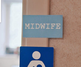 Tag labeled "midwife," looking into an office area / Eau Claire, Wis., midwife