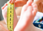 Nurse measuring a baby's foot - What do growth charts mean?