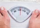Person standing on a scale - Risks of being underweight