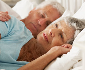 Senior woman having trouble falling asleep - Cancer and sleep loss