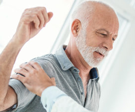 Senior man stretching his arm - Rotator cuff surgery