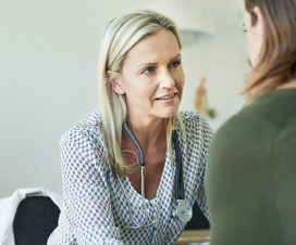 Doctor encouraging a female patient - What to know about a miscarriage