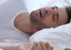 Man snoring on his bed - Night shift sleep tips
