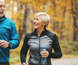 Senior man and woman out for a jog in fall - Heart attacks in women