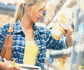 Woman grocery shopping - Do food expiration dates matter?