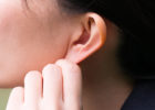 Girl pulling on her ear lobe - Ear deformity in kids