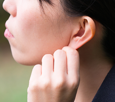 Girl pulling on her ear lobe - Ear deformity in kids