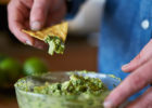 Person dipping chip in guacamole - Double dipping