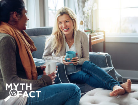Woman laughing and enjoying coffee - Ovarian cancer, myths and facts