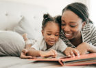 Mom and daughter reading a children's book in bed - Stereotactic body radiation therapy (SBRT)