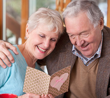 Elderly couple looking at a card - What is TAVR?