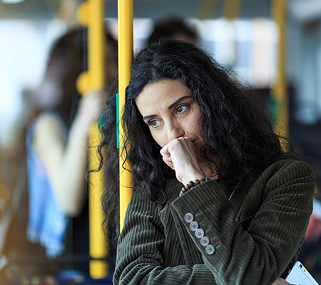 Woman on a bus coughing - Substance abuse: Stigma and making changes
