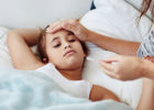Girl with a fever in bed - What is Kawasaki disease?