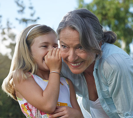 Young girl with grandmother / hearing loss