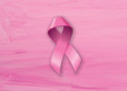 Pink background with a breast cancer ribbon - Signs of inflammatory breast cancer