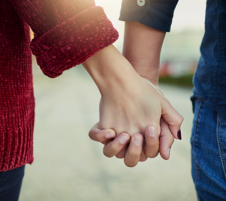 Couple holding hands - Sexual health and intimacy