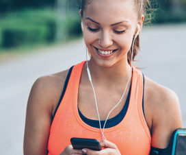 Woman texting during her run - Building strong bones while you're young