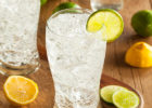 Photo of carbonated water in a glass with lemon and lime