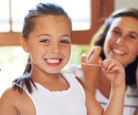 child flossing / dental health / parent