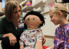 A Child Life specialist interacts with a patient.