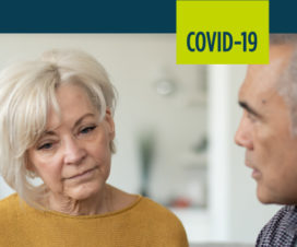 A woman listens as her doctor explains why she might be more susceptible to COVID-19 due to her chronic disease.