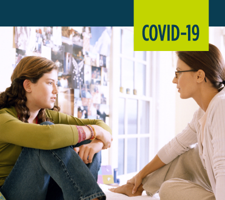 A woman talks to her daughter about COVID-19.