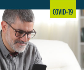 A man uses an online portal to check his risk for COVID-19.
