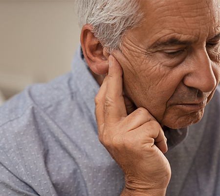 Image of elderly man having trouble hearing
