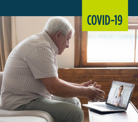 Image of elderly man having a telehealth appointment with his doctor
