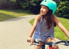 A girl rides her bike.