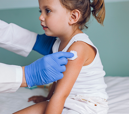 Girl receives influenza shot