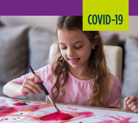 child painting during COVID-19 times