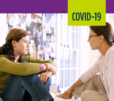 woman talking to teen about COVID-19
