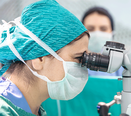 A doctor uses a robot to assist her during surgery.