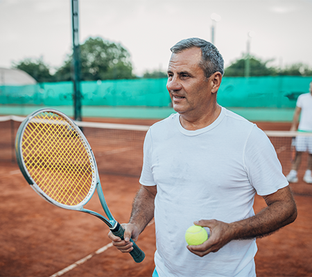 Man playing tennis - tennis elbow 