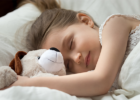 child sleeping with stuffed animal