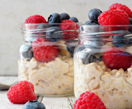 oatmeal in jar with berries on top