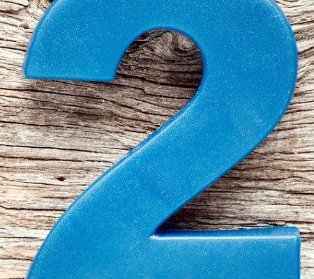 Blue number two on the wooden background