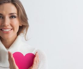 woman holding paper heart
