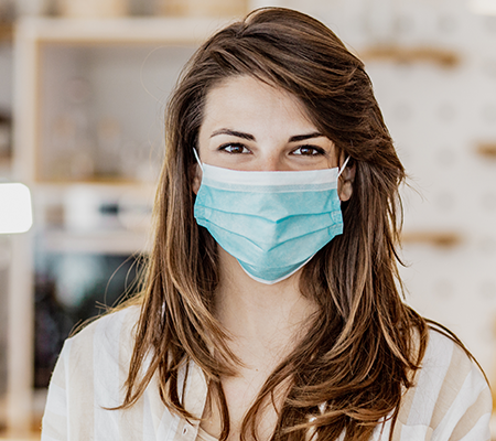 woman with mask on to prevent the spread of COVID-19 and flu