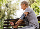 woman outside sitting on a bench after exercising