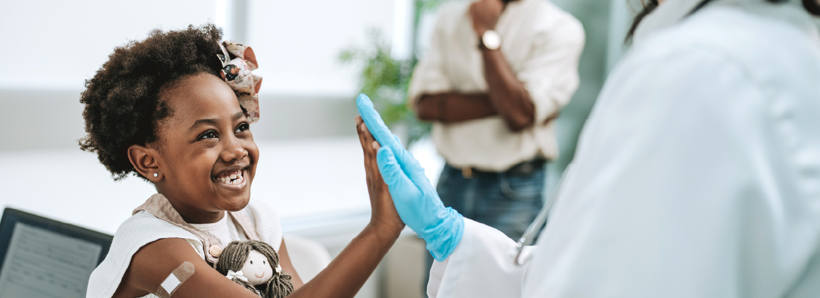 kid high-fiving doctor after appointment