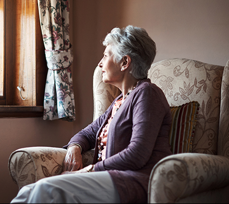 Shot of a senior woman sitting alone in her living room