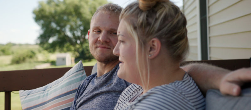 Couple sitting talking about weight loss surgery