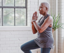 woman in yoga pose considering her risk for hip fractures