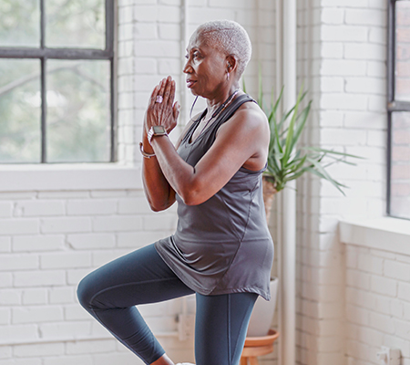 woman in yoga pose thinking about her risk for hip fractures
