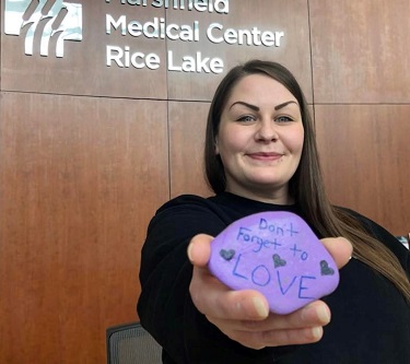 Jamie Thibedeau, Rice Lake's new substance misuse recovery coach, holding a love rock